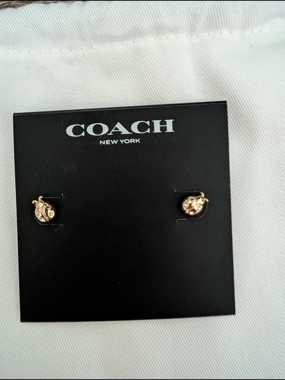 Coach Gold Tone Ladybug Stud Earrings with Crystal Accents - Picture 2 of 3